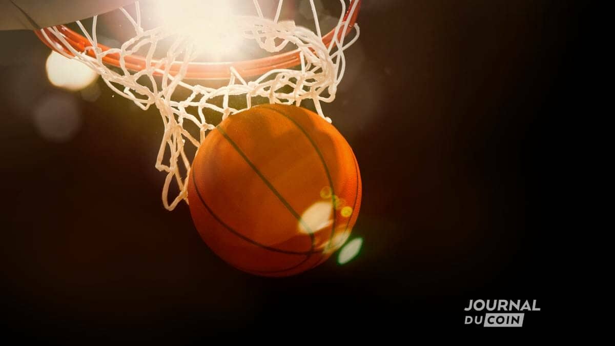 Ballon de basket qui passe dans un panier à trois points.