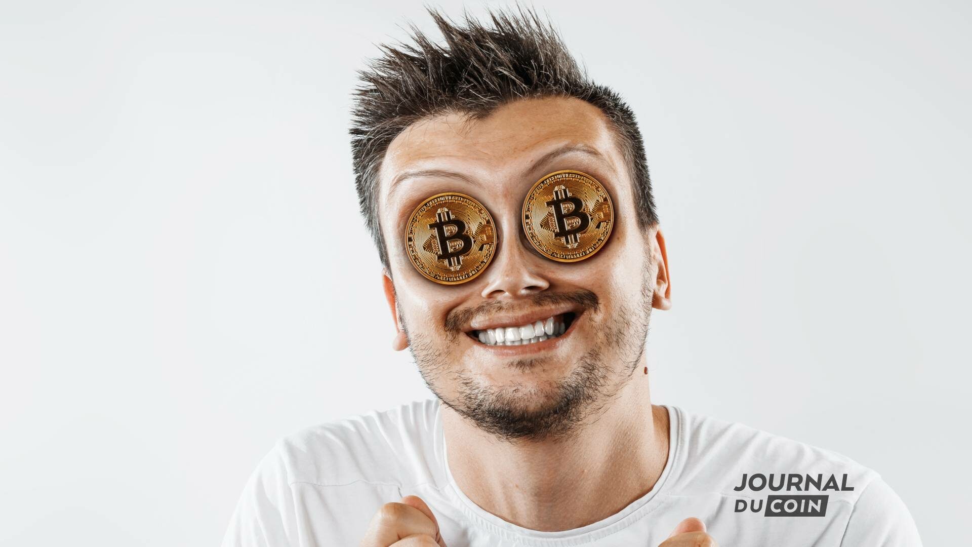 Homme content avec des bitcoins dans les yeux 