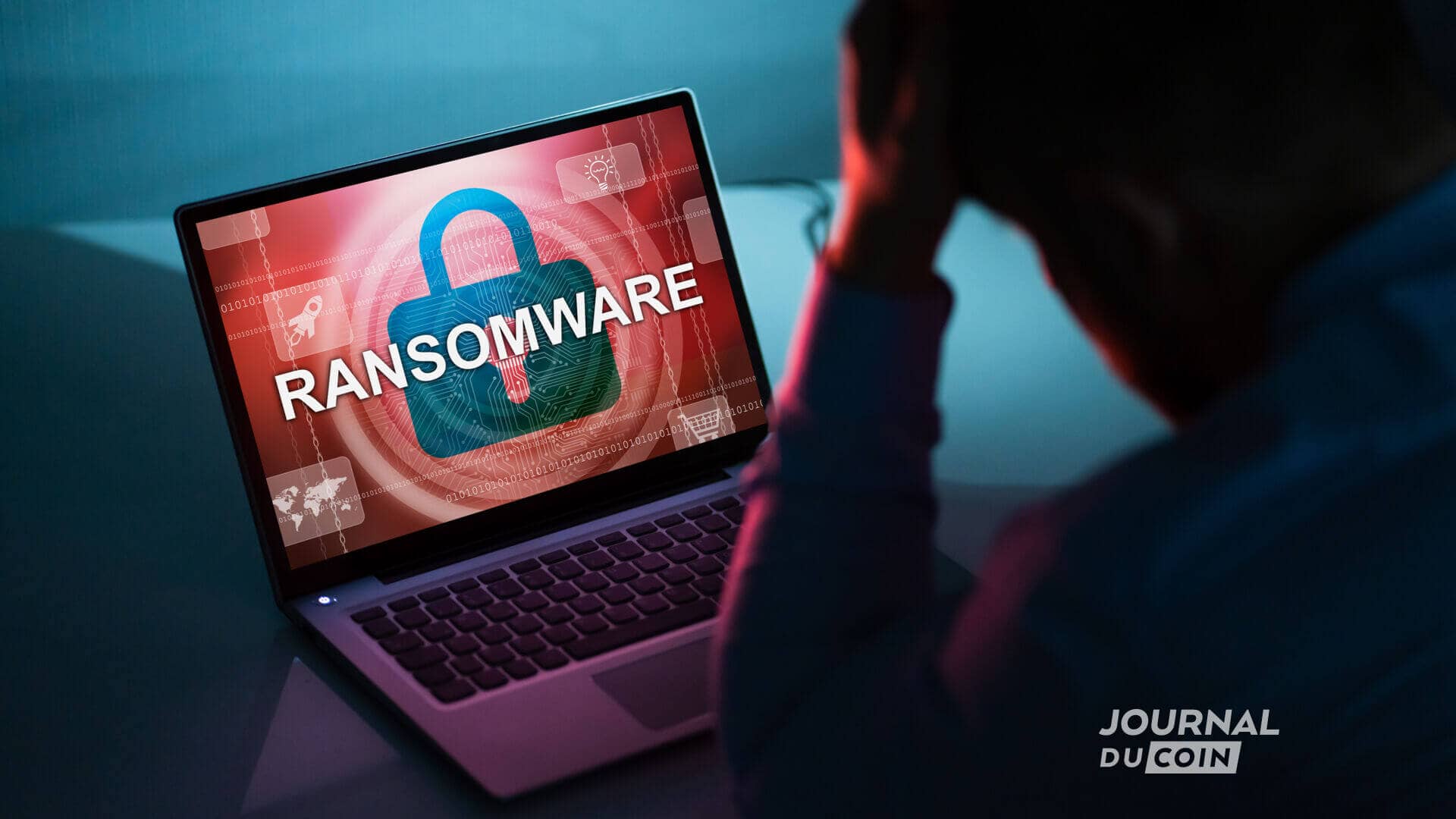 Une personne anxieuse devant son ordinateur qui se fait attaquer par un ransomware