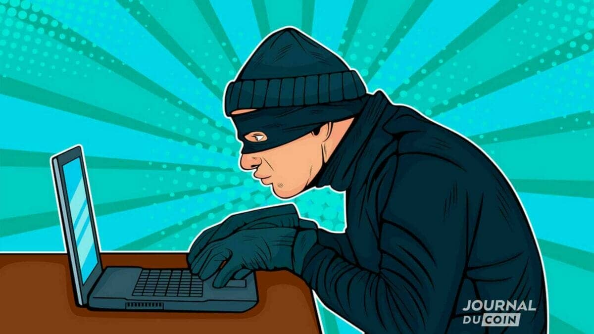 Un hacker masqué devant un clavier 